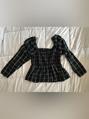 Old Navy￼ off-the-shoulder top in a dark green plaid pattern.